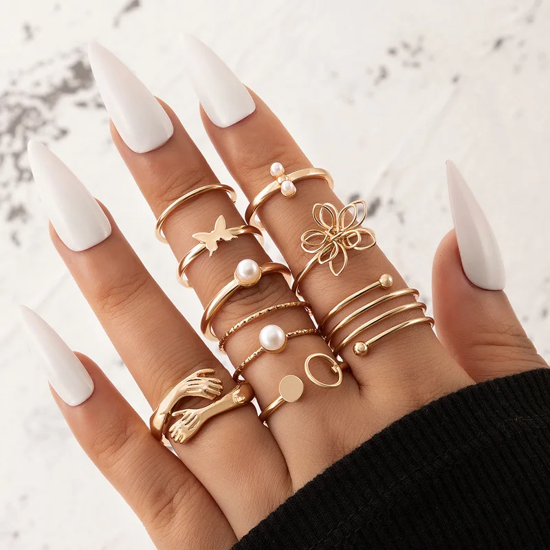

New 2022 Three-dimensional Hollow Flower Pearl Eight-piece Ring Set Butterfly Opening Ring Set