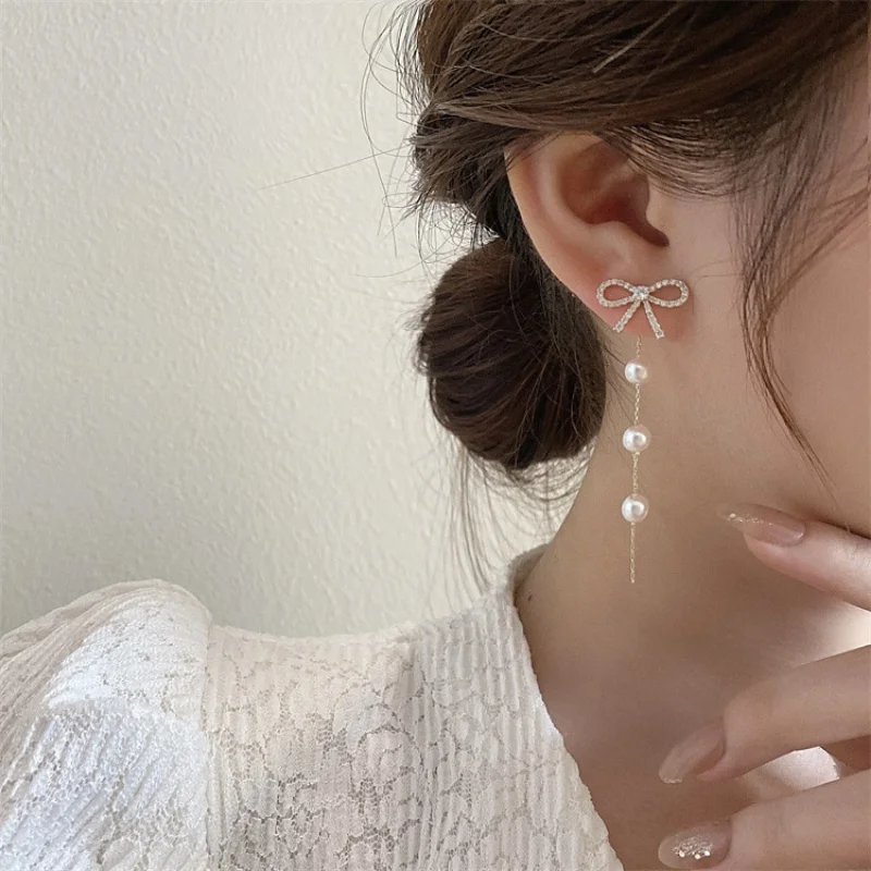 

Minar Elegant Imitation Pearls Strand Bowknot Tassel Earring for Women Bling CZ Zircon Hollow Knotted Long Dangle Earrings Gift