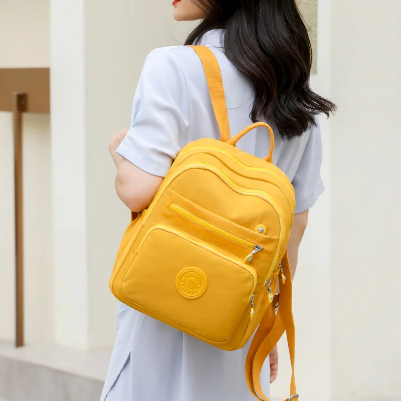

Новинка Весна 2023, желтый женский Рюкзак, Высококачественная Водонепроницаемая нейлоновая дорожная сумка, повседневный модный школьный Рюк...