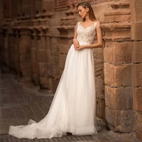 a line tulle wedding dress 2022 elegant sheer o neck tassel lace appliques sweep train sleeveless bridal gown with button back