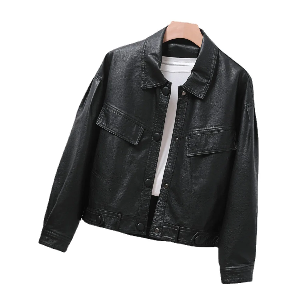 Single breasted loose version of women's short black lapel leather coat