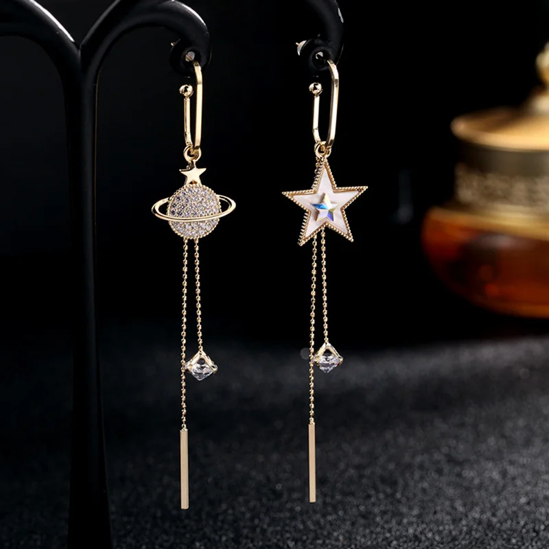 

Korean East Gate Earrings female S925 silver needle long tassel fashion Shell Earrings asymmetric planet Earrings