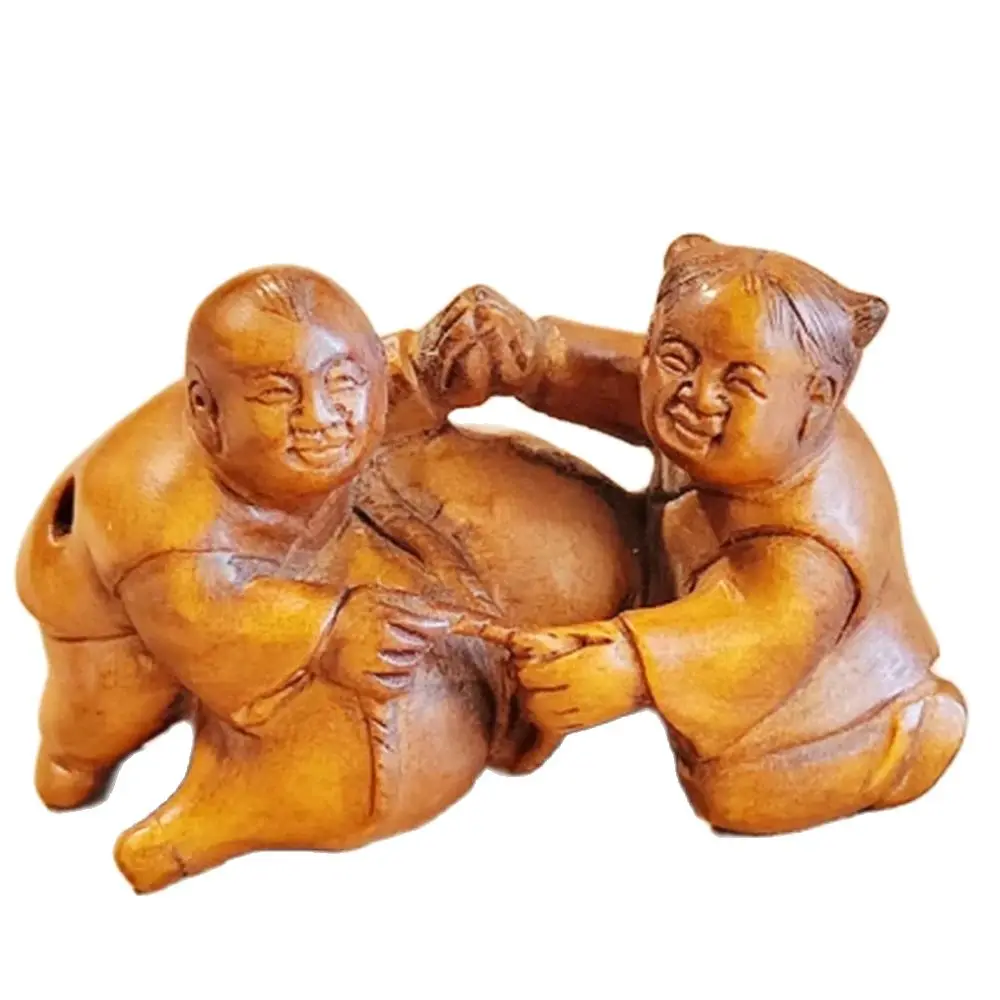 

Деревянная статуэтка из самшита, мальчик и девочка с тыквой