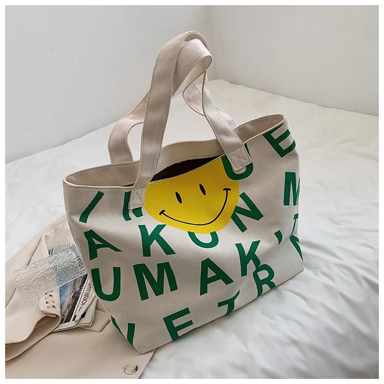 

2022New Casual Women's Bag Cartoon Casual Letter Smiley Face Large Capacity Canvas Bag Hand Carry Shoulder Bag Tote Bag Designer