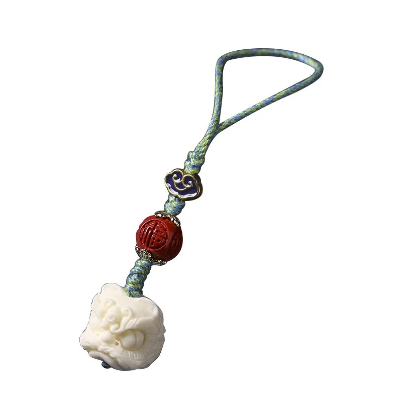 Брелок с подвеской в виде фрукта слоновой кости и льва