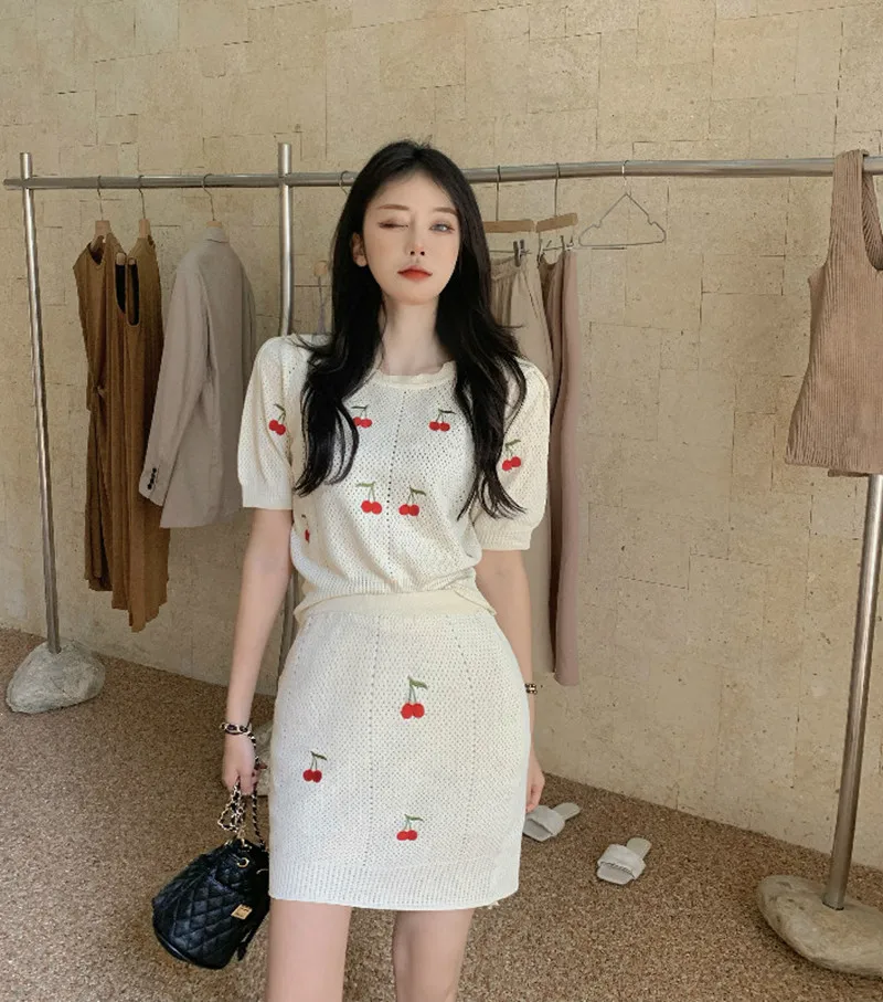 

DALMAZZO 2022 New Summer Women Embroidery Knit Suits Clothes Hollow Out Sweater Tops + Package Hip Mini Skirt 2 Piece Sets Femme