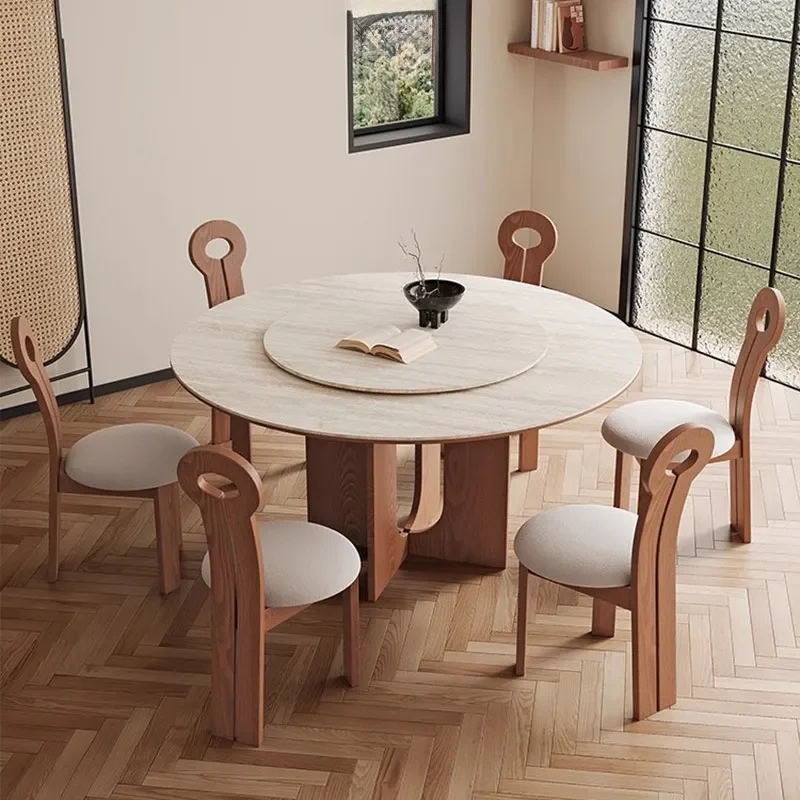 Фото Ретро-круглый обеденный стол из травертина с креслами из массива черного ореха. Современный комплект кухонной мебели для дома. №2