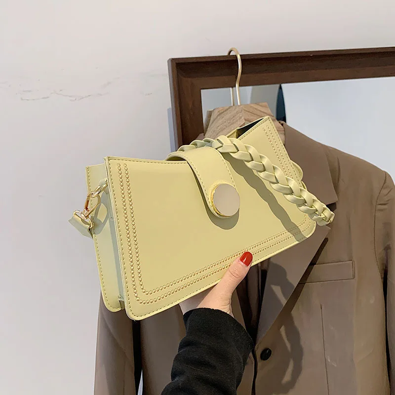 

New Korean version of one-shoulder messenger bag embroidered thread non-woven handbag round buckle underarm handbag