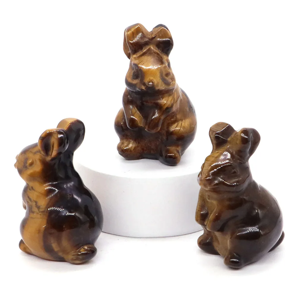 Фигурки кроликов из черного обсидиана, тигрового глаза и розового кварца