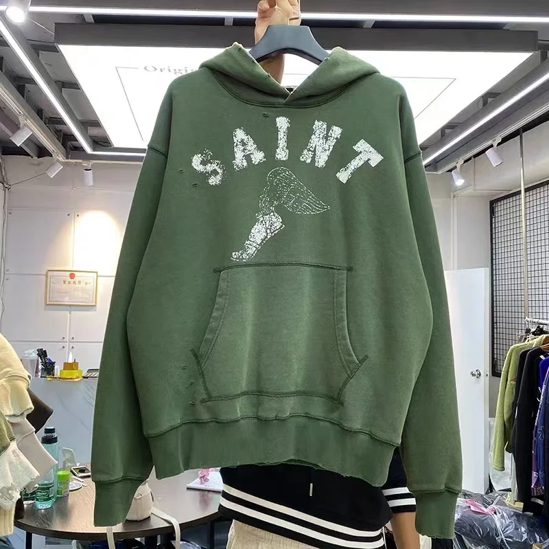 

Graffiti, beat-up, ripped, loose-knit hoodie