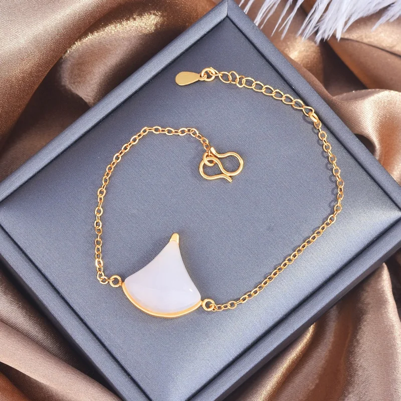 Женский ювелирный комплект из браслета и юбки