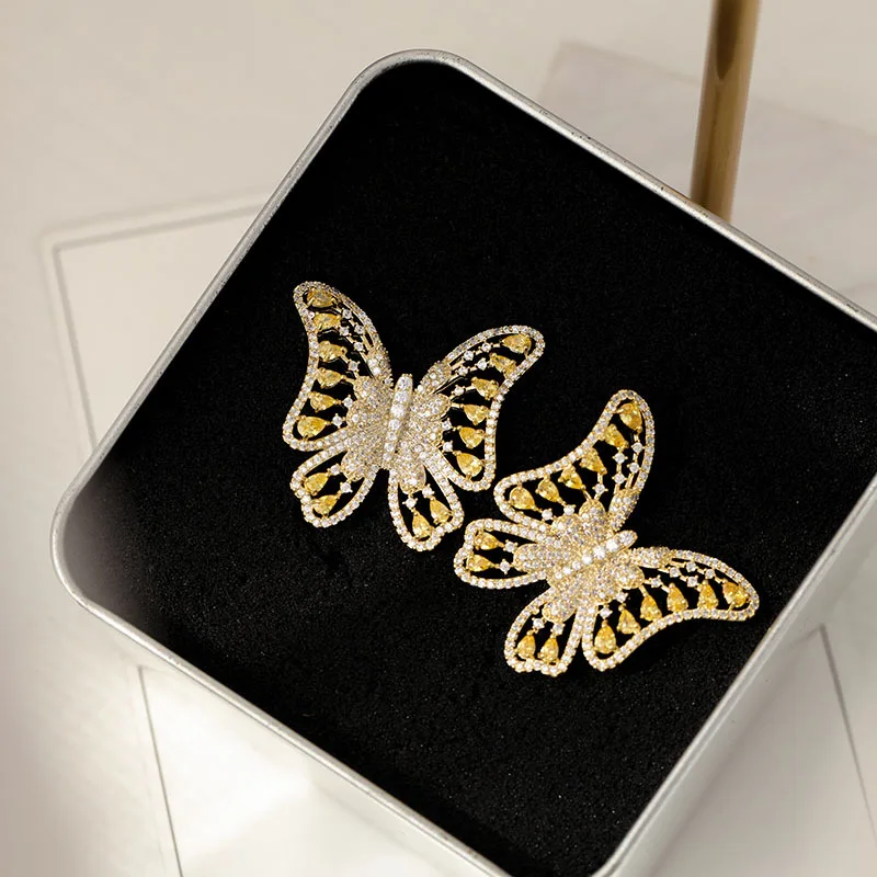 

Europe new hollow butterfly yellow zircon earrings sparkling crystal delicate insect stud earring for women wedding jewelry