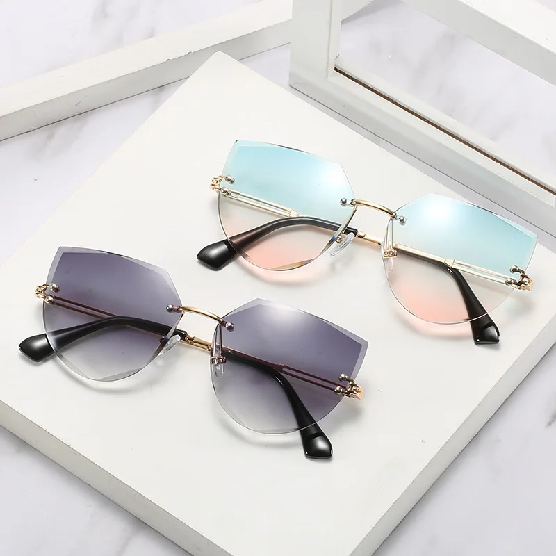 

New Personality Frameless Trim Cat-eye Sunglasses for Women Hot-selling Trend Fashion UV Driving Street Shooting Catwalk Glasses