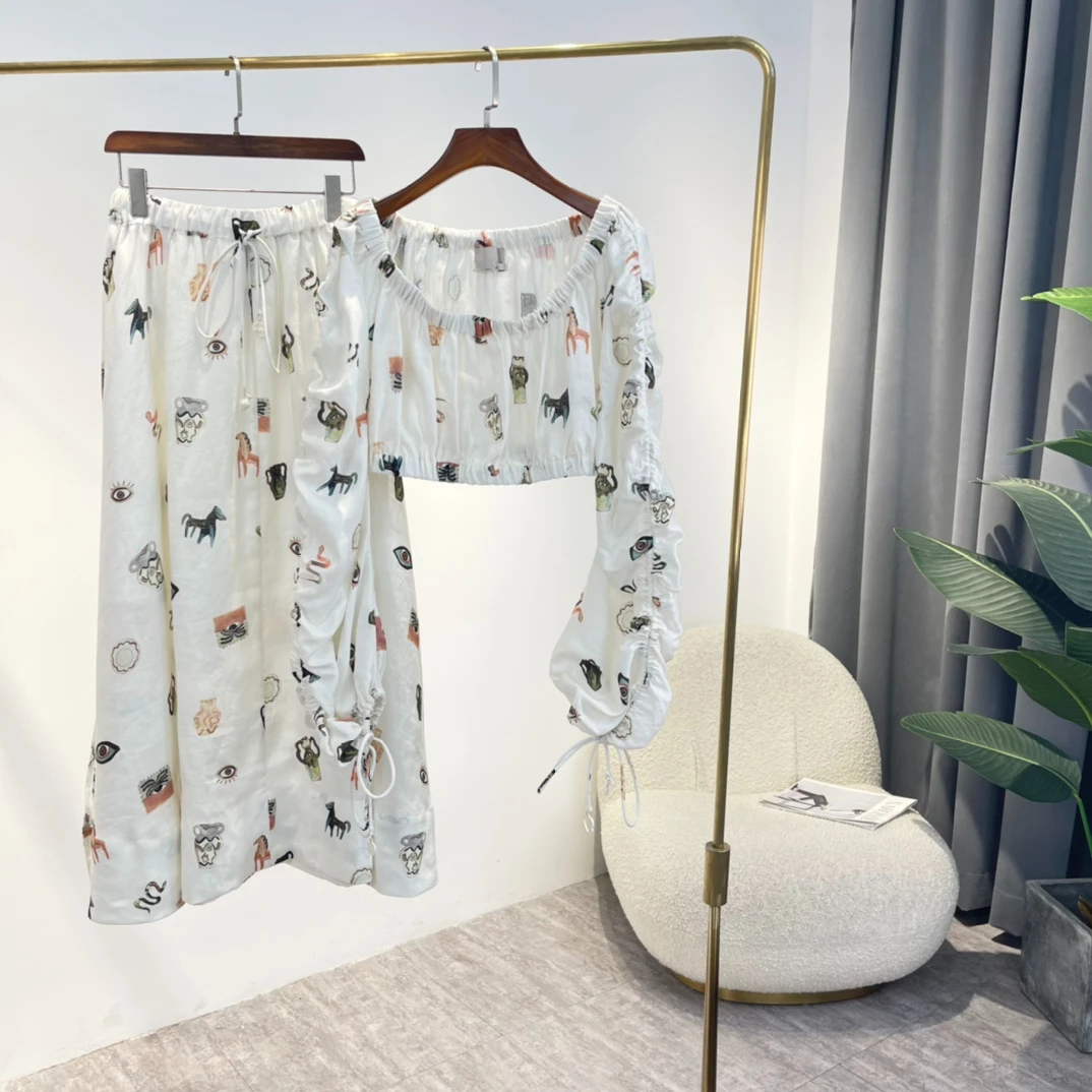 

2022 Latest Summer High Quality Hemp Pink White Ornaments Drawstring Cartoon Print Off The Shoulder Elastic Waist Top Skirt Suit