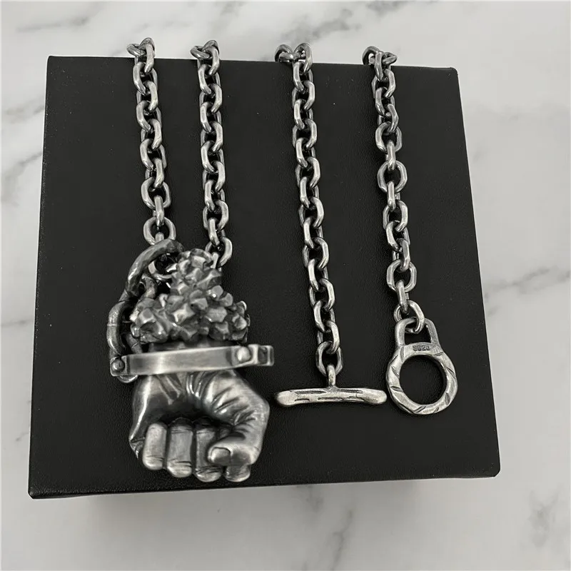 

Power fist Pendant Necklace
