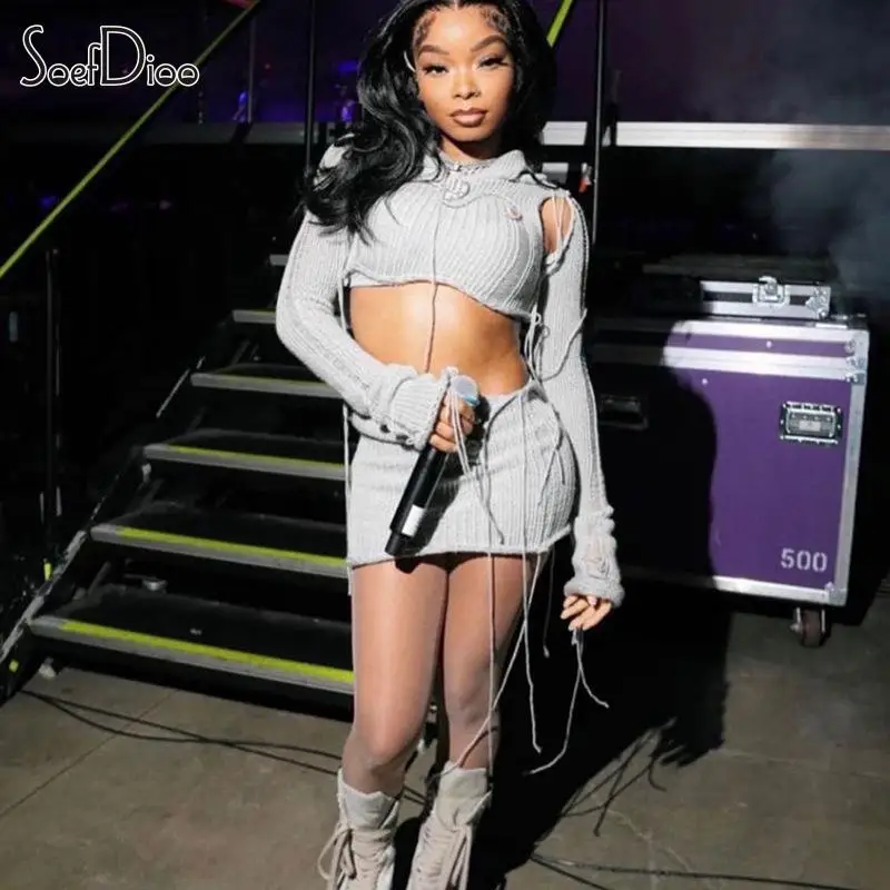 

Soefdioo Knitted Hollow Out Two Piece Set Women Sexy Hooded Long Sleeve Crop Top and Mini Skirt Suits 2023 Baddie Street Outfits