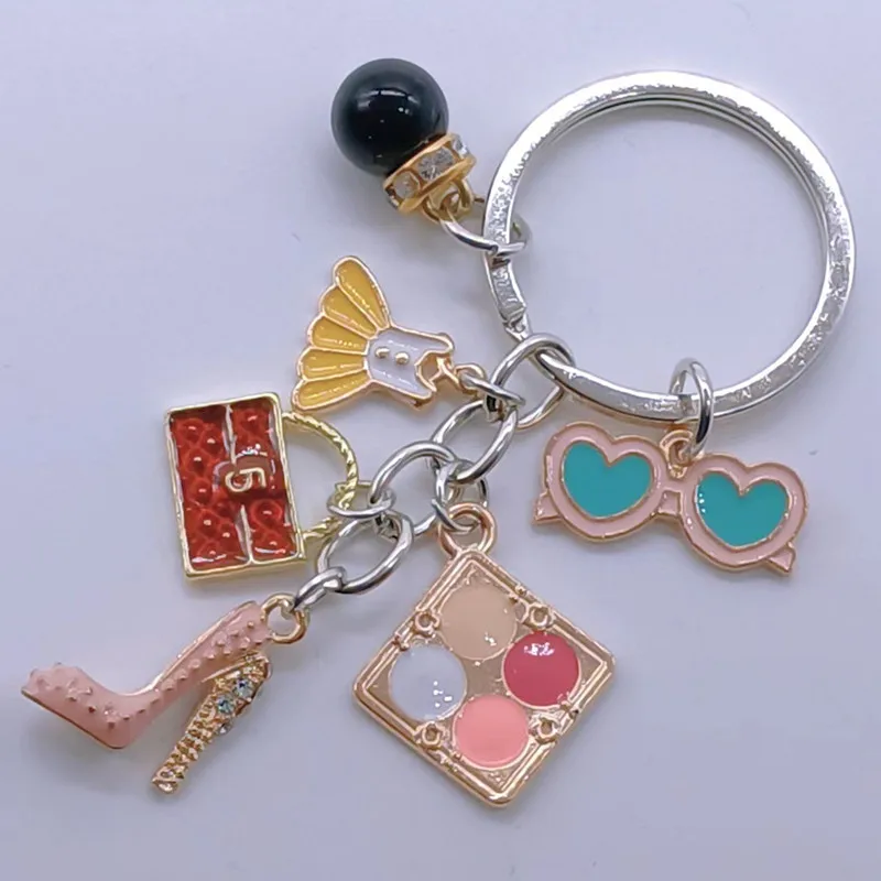 Новый брелок-подвеска Шарм Восхитительная мода Стразы Высокие каблуки Сумка Юбка Косметический чехол Очки Аксессуары Дамские украшения.