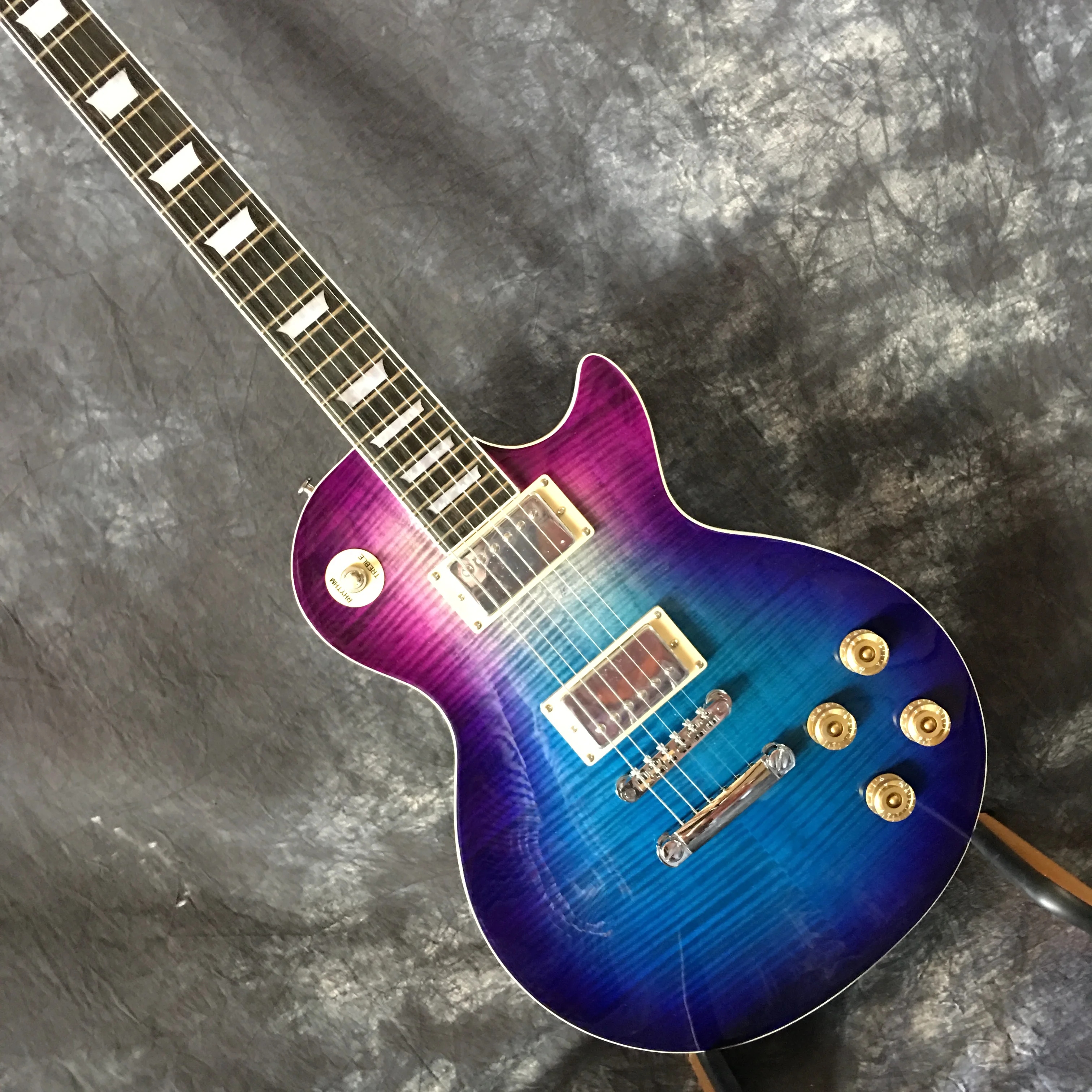 

Flamed maple top blue six string LP electric guitar, with fret binding our store supports customization guitar