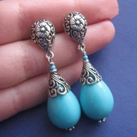 vintage drop shaped inlaid blue stone earrings personality silver color metal carving spinning whirling flower dangle earrings