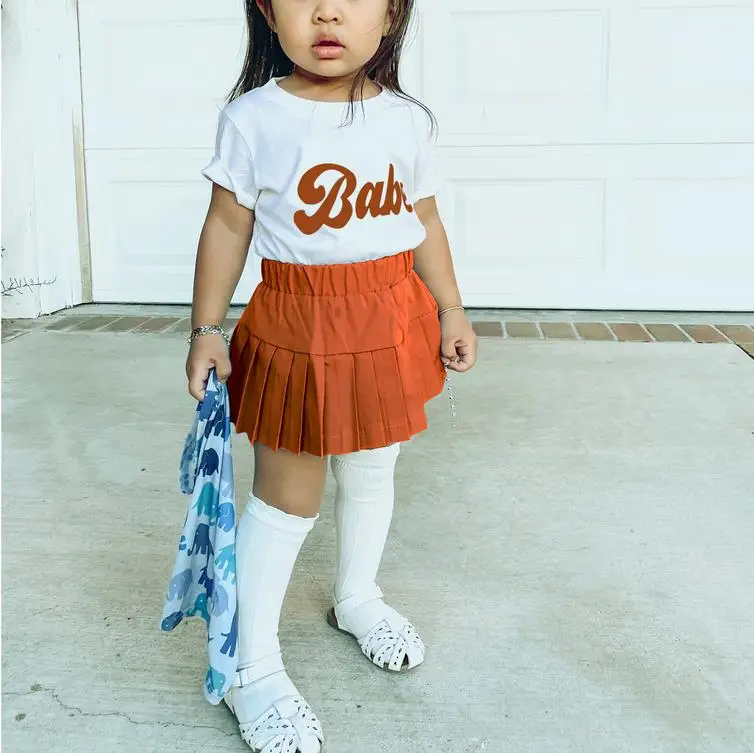 

Летний комплект из 2 предметов для маленьких девочек, белая футболка с коротким рукавом и буквенным принтом + однотонная плиссированная юбка, 6 месяцев-4 года