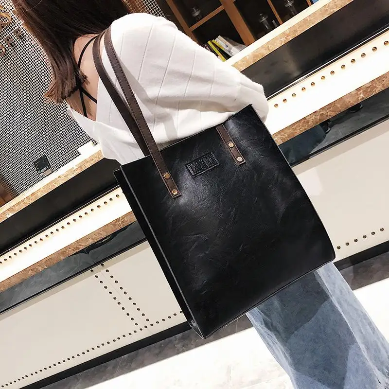 2021 Spring and autumn new women's bag European and American retro simple fashion briefcase