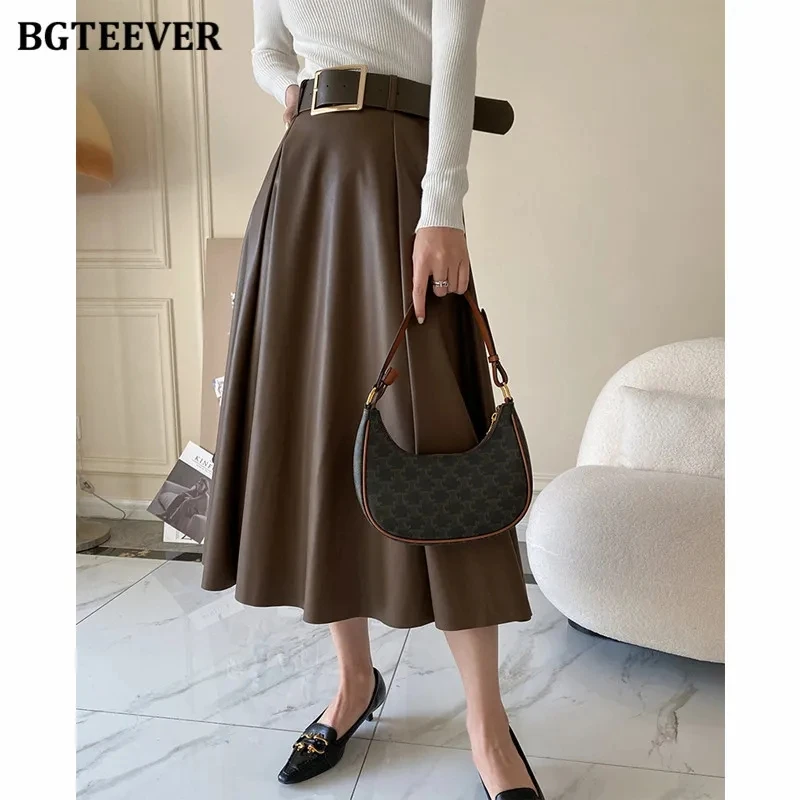 

BGTEEVER Autumn Winter High Waist A-line PU Leather Skirts Women Elegant Loose Belted Faux Leather Midi Skirts Female