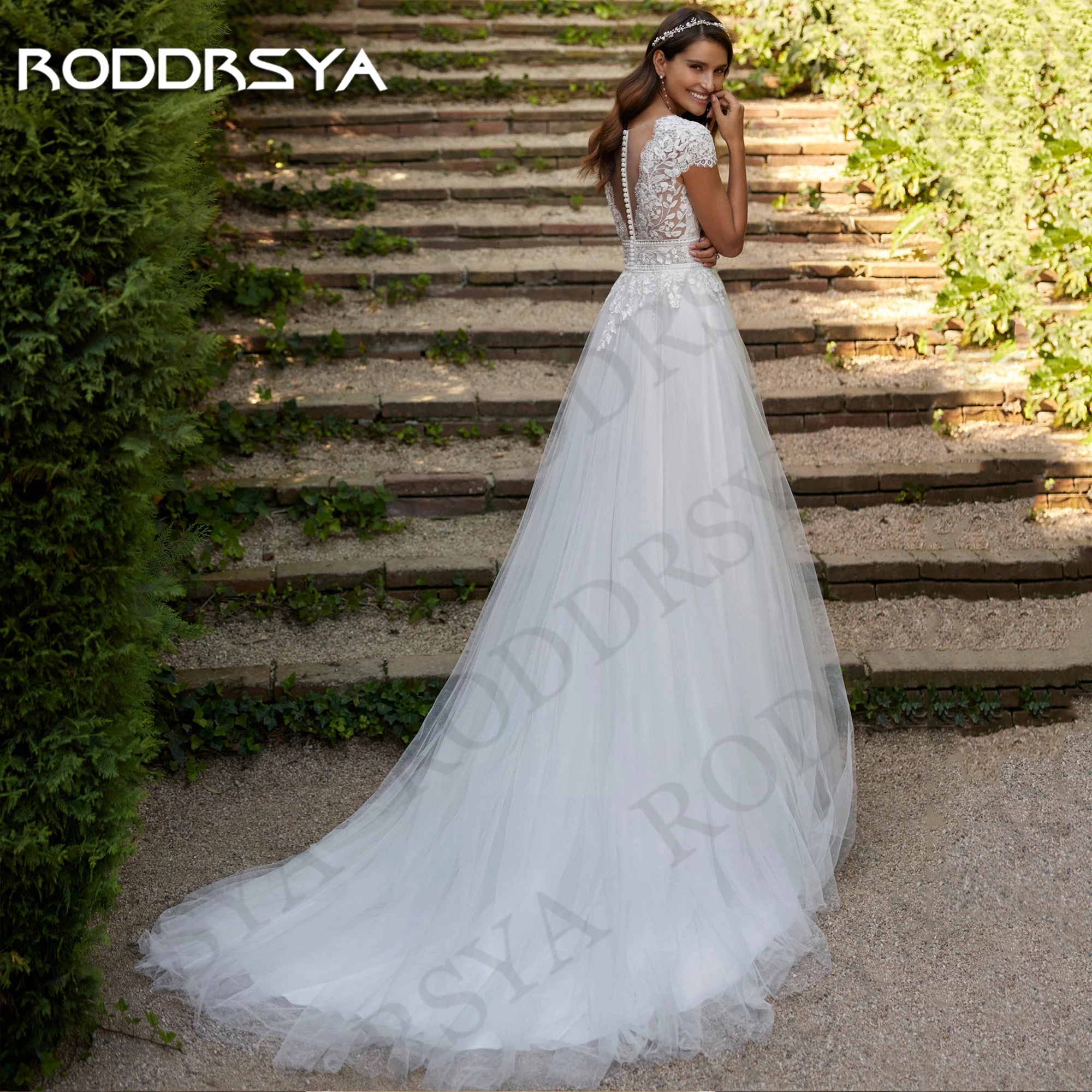 Фото Свадебные платья RODDRSYA А-силуэта в стиле бохо 2025  богемные свадебные платья индивидуальное кружевное фатиновое платье невесты с V-образным вырезом Свадебное платье A Line Богемия 2025 Заказать кружевные наклейки п №2