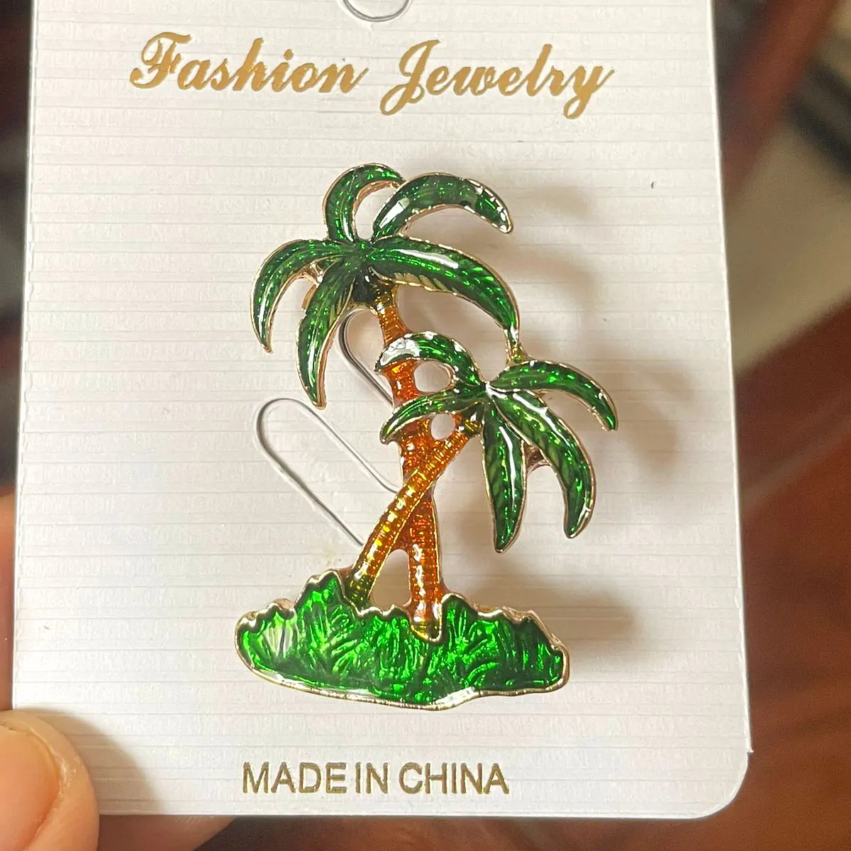 Женская брошь со стразами