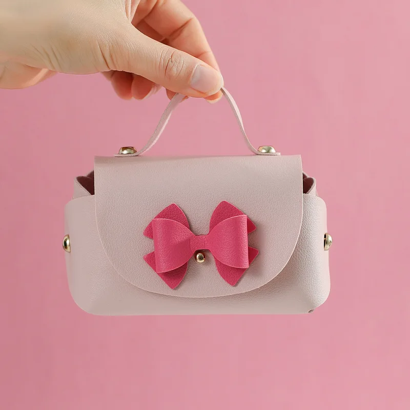 

5pcs Small Leather Gift Box New Creative Handbag Shape Ribbon Bow Candy Dragee Gift Box with Hand Wedding Bonbonniere Gift Bag