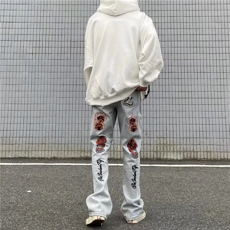 American High Street Heavy Industry Flame Skull Embroidery Jeans Men and Women Fashion Brand Ruffian Shuai Slim Flare Pants