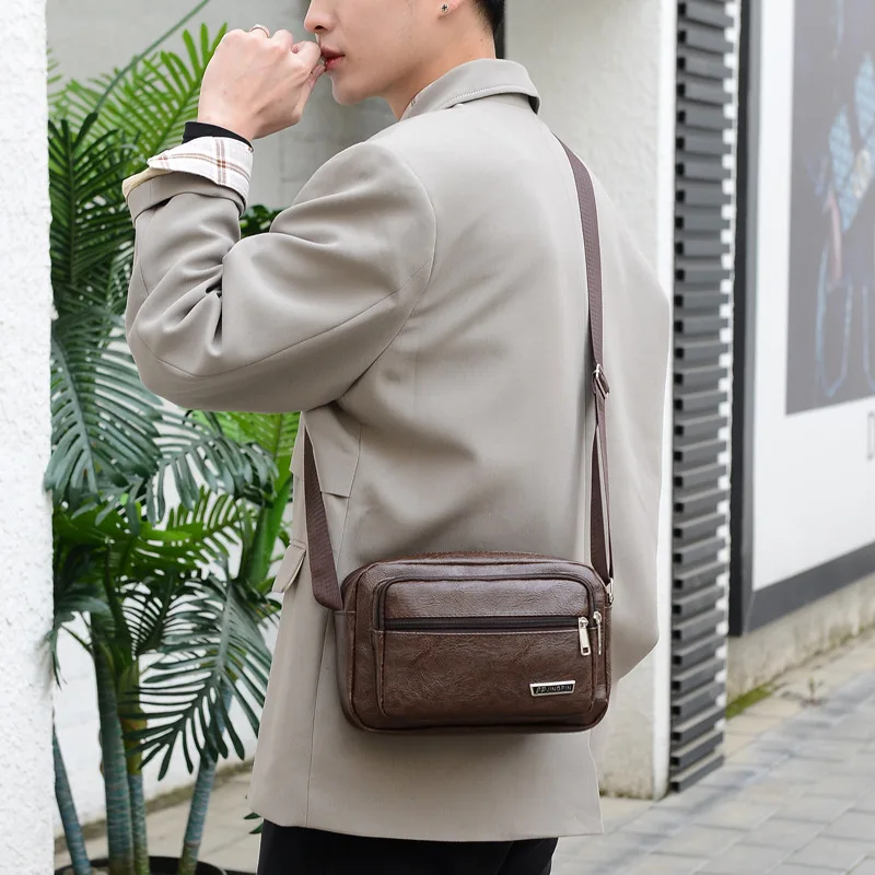 

2022 Korean Version of The New PU Leather Backpack Trendy Business Large-capacity Messenger Bag Imitation Leather Men's Backpack