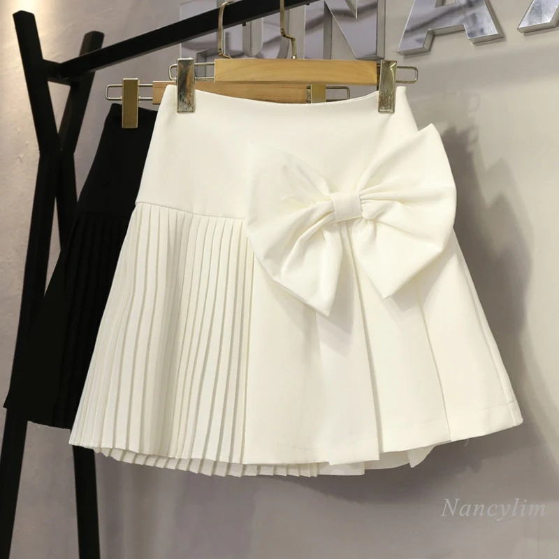 

Новинка лета 2022, милая дизайнерская стройнящая юбка-трапеция с завышенной талией и бантом, женские универсальные мини-юбки белого и черного...