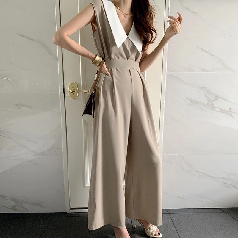 

Clothland Women Khaki Vintage Jumpsuits Sleeveless Turn Down Collar Bow Tie Belt High Waist Office Wear Playsuits KA137