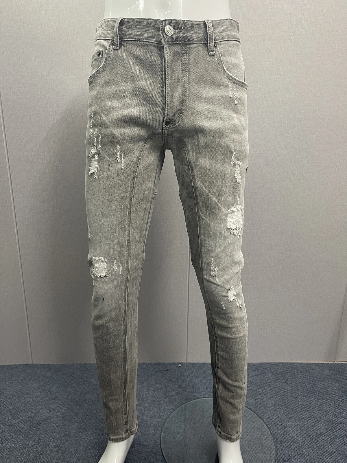 

Spring and summer 2023 fashion men wash wear hole patch splashing ink three-dimensional cutting small feet dark blue jeans man