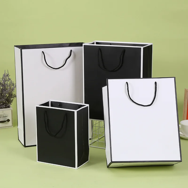 

12PCS Simple Black White Bag Shopping Mall Clothing Shopping Bag Factory Wholesale Customized Logo Fashion Advertising Bags