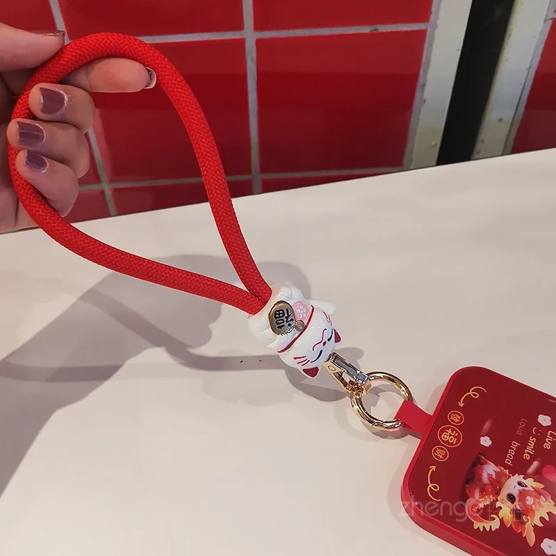 Ремень Zhaocai на запястье Женский короткий ручной держатель для телефона с Красной