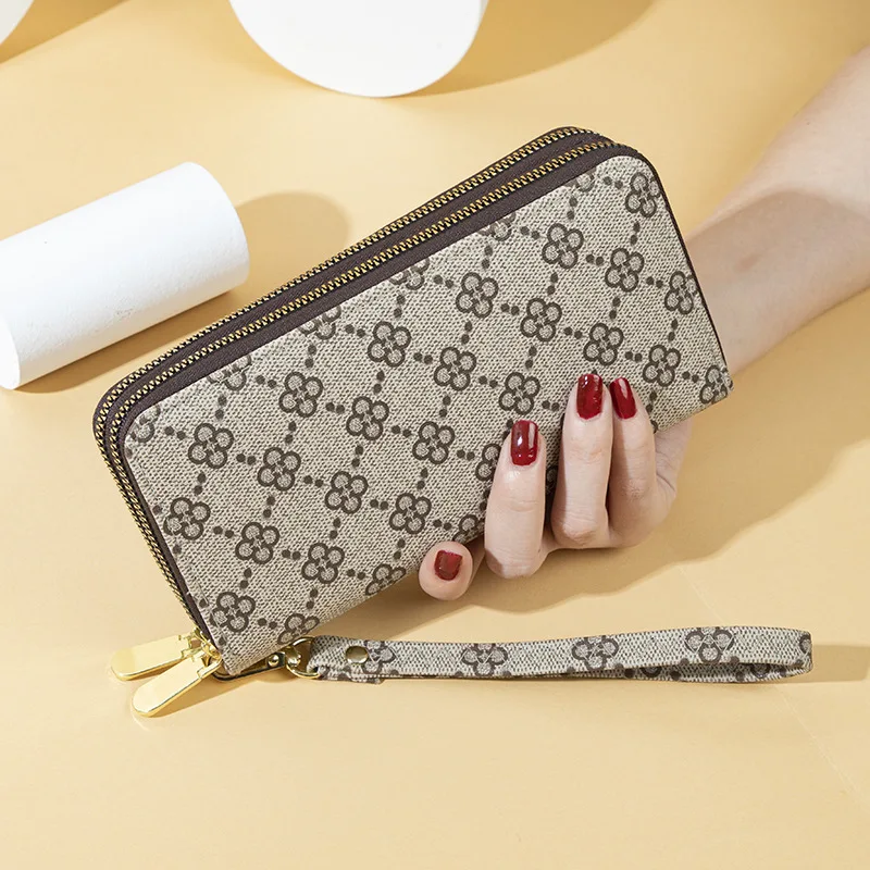 

Long ladies double zipper wallet fashion four-leaf flower printing large capacity Jane mobile phone bag clutch bag.