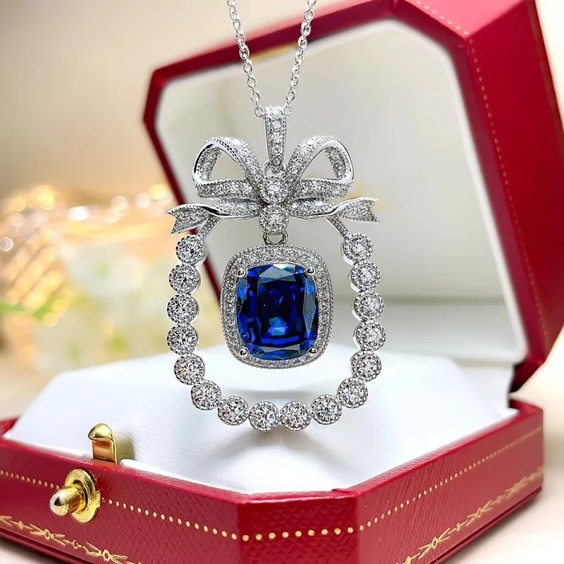 

New Exquisite Cute Bowknot Design Silver Color Pendant Necklaces Inlaid with Simulation Sri Lanka Sapphire Necklace For Women