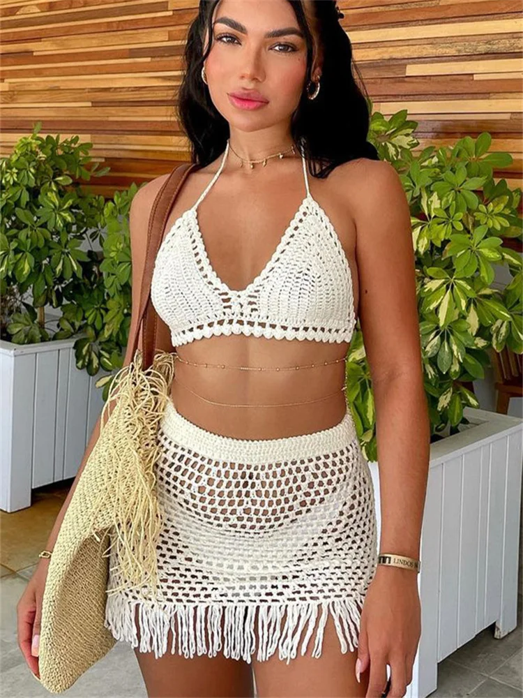 

CHRONSTYLE Women Knitted 2 Pieces Suit White Solid Backless Halter Tie-up Tank Crop Tops Tassels Hem Hollow Out Mini Skirts 2022