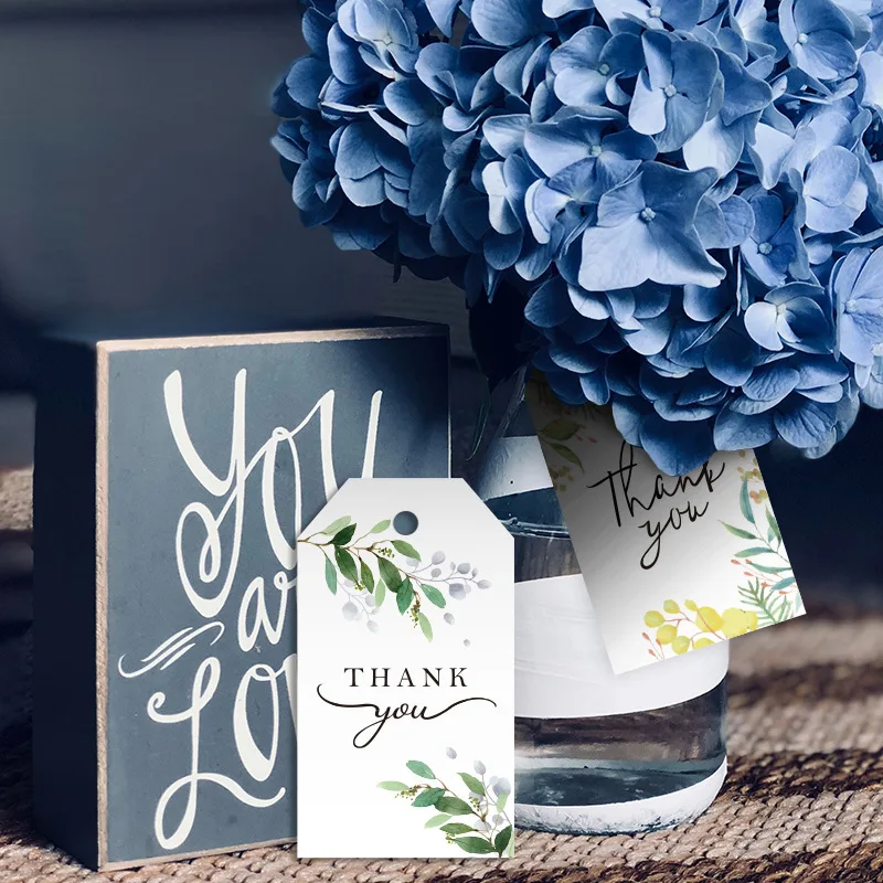 

100pcs Green Leaves Printed Garment Tags Thank You Labels Kraft Paper Tag Cards Luggage Clothing Shoes Bags DIY Apparel Crafts