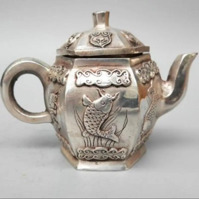 

China's pure white copper carving carp teapot