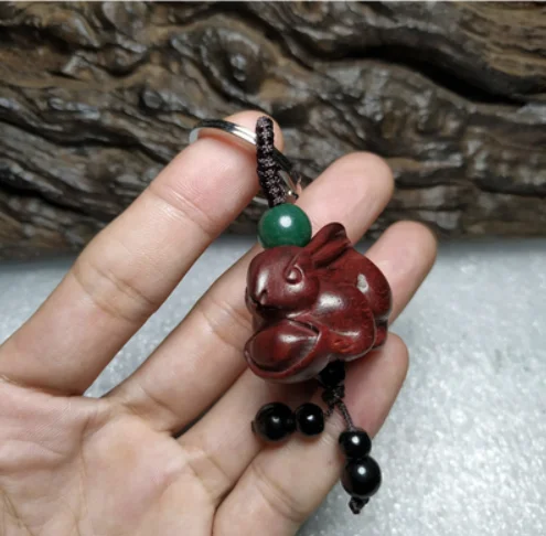 

Peach wood carving rabbit Handmade wooden pendant pendant cute mahogany keychain ebony
