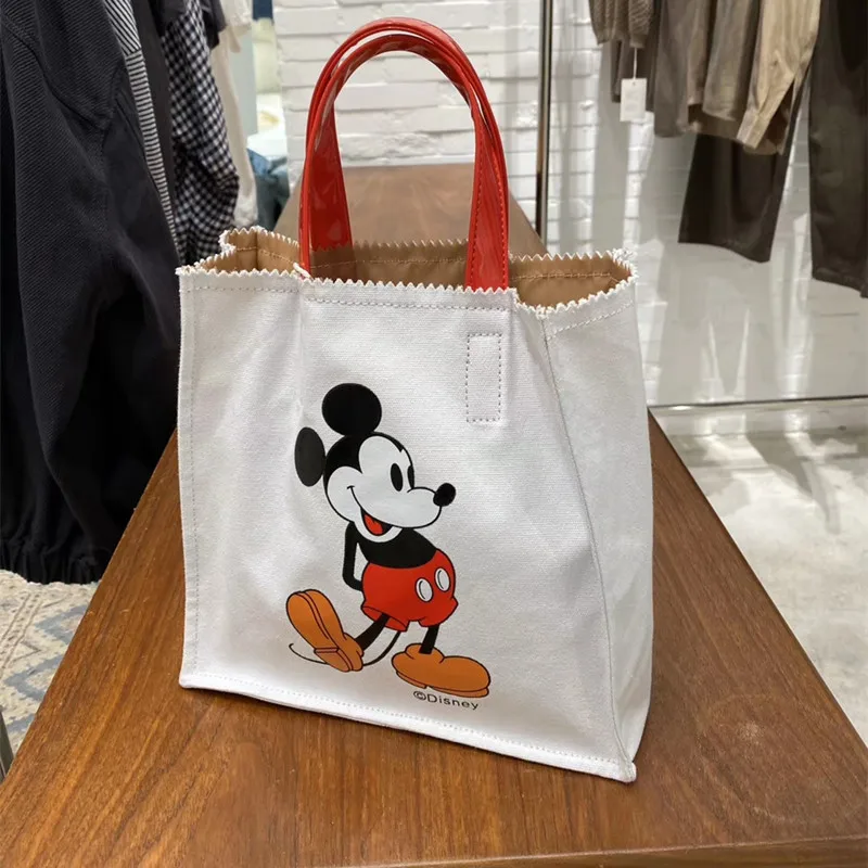 

Disney children's cute Mickey Mouse handbag cartoon hit color canvas women bag lady shoulder bags