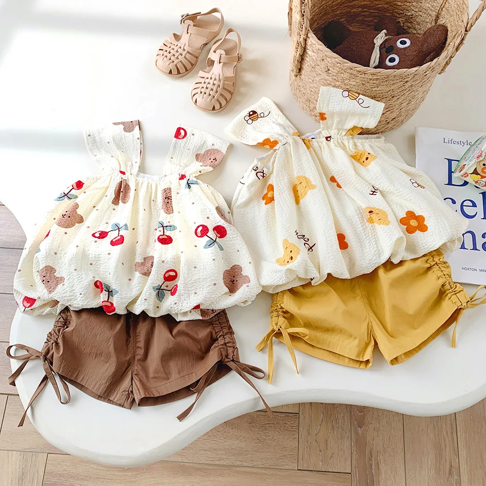 

Новинка 2023, комплект для девочек, летняя одежда для маленьких девочек, топы и шорты на бретелях с принтом, костюмы из 2 предметов, корейская модная детская одежда