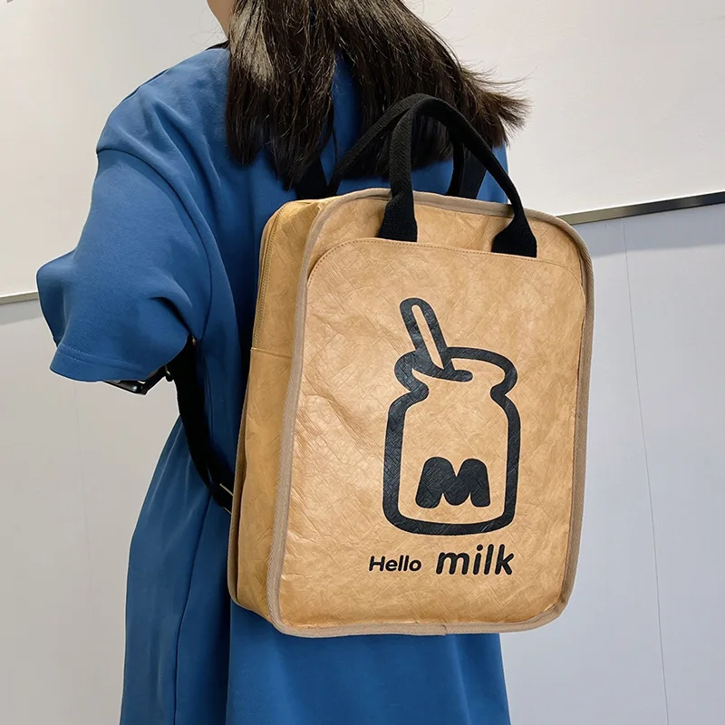 

Моющиеся сумки из крафт-бумаги для мужчин и женщин, повседневный рюкзак, модные компьютерные сумки, милая сумка через плечо с молочным принтом, новинка 2023