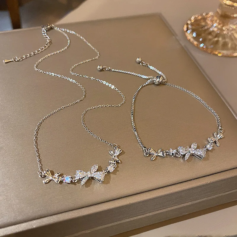 

Popular micro diamond studded bow titanium steel necklace women's ins trendy luxury small group bracelet two-piece set
