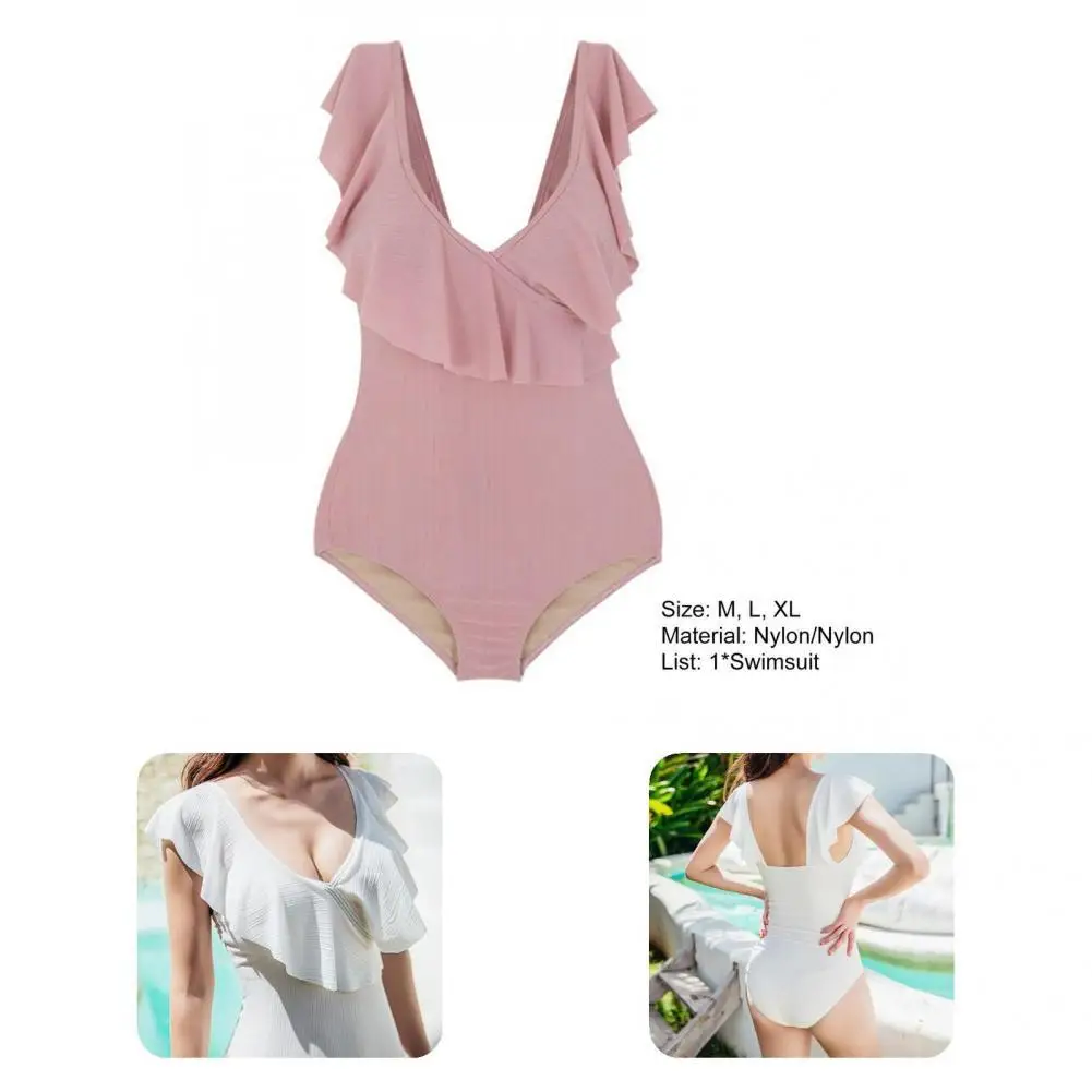 

Стильный женский купальник с открытой спиной и глубоким V-образным вырезом