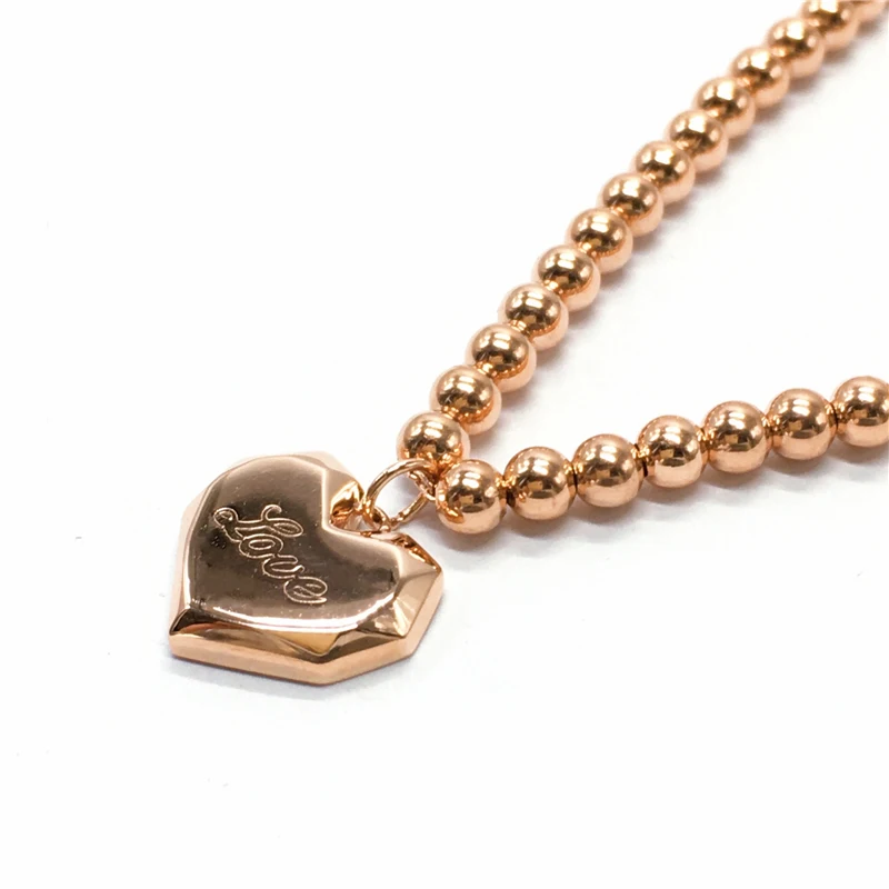 Женский браслет из розового золота 585 пробы с круглыми бусинами