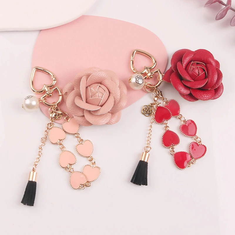 

New Love Camellia Keychain Woman Leather Keychain Creative Pearl Tassel Pendant Headset Case Bag Decoration Party Accessories