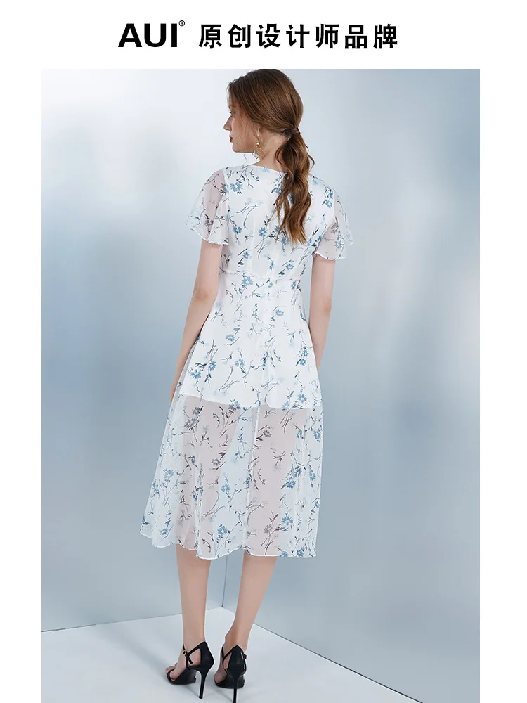 

Женское длинное асимметричное платье с оборками по краям